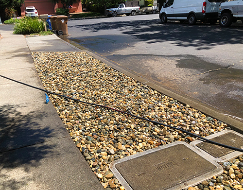 We removed a dead patch of grass from a parking strip and laid down fresh rocks here in Napa CA